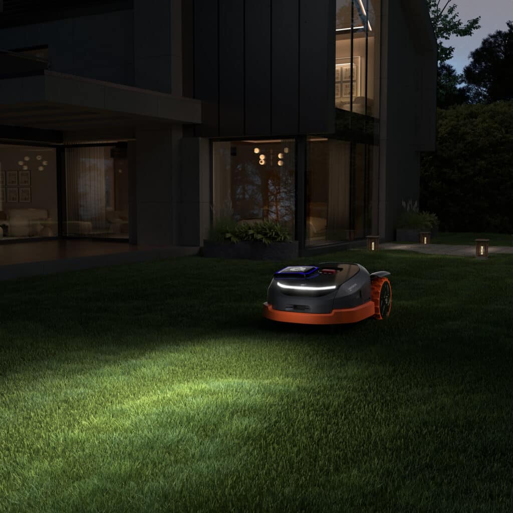 Robot tondeuse Navimow Segway X3 en action dans un jardin parfaitement entretenu - Performance exceptionnelle du modèle haut de gamme distribué par AP Robots, garantissant une pelouse impeccable sans effort.